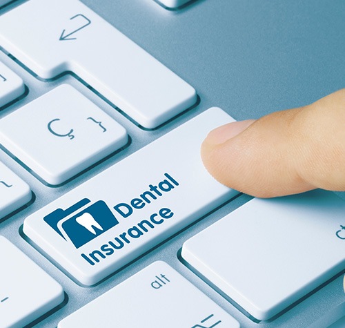 Norwood patient reviewing dental insurance for implants