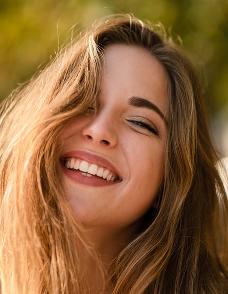 Woman smiling outside