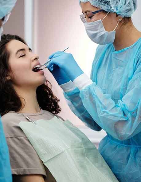 Dentist examining a woman’s mouth