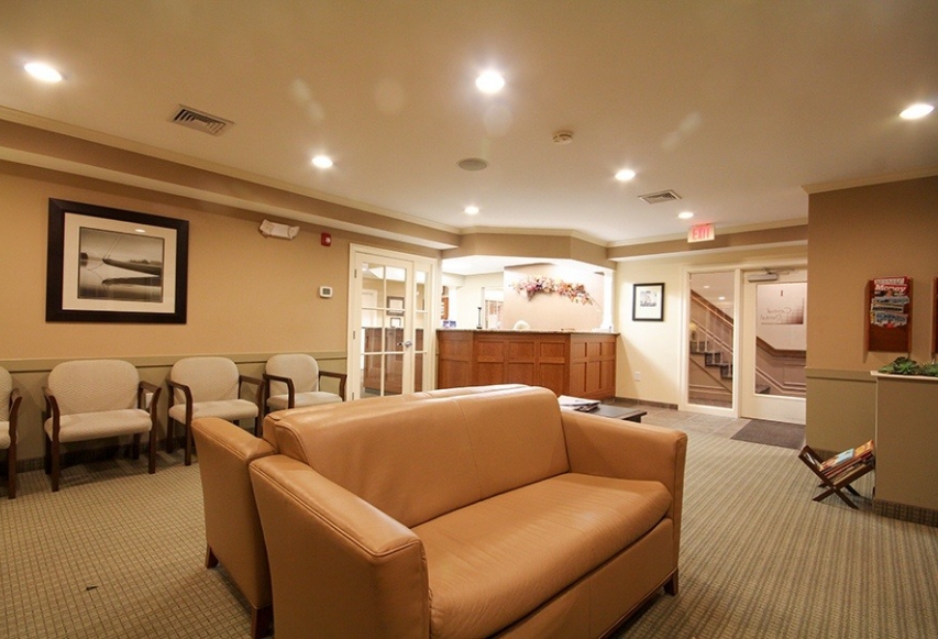 Couches and chairs in dental office waiting area