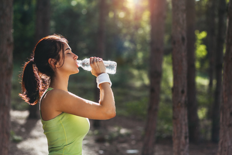 Patient drinking water for good oral health